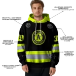 custom-oakland-athletics-safety-motif-black-neon-green-hoodie-best-selling.webp